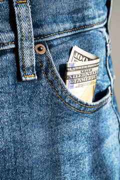 US 100 dollar bill in pocket of jeans.  Money inside  jeans pocket.