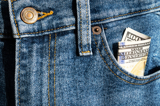 US 100 dollar bill in pocket of jeans.  Money inside  jeans pocket.