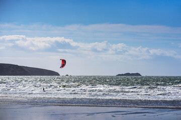 Kitesurfer on Broadhaven Beach, Pembrokeshire Coast National Park, Wales, United Kingdom