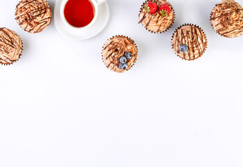Background with chocolate cupcakes and tea