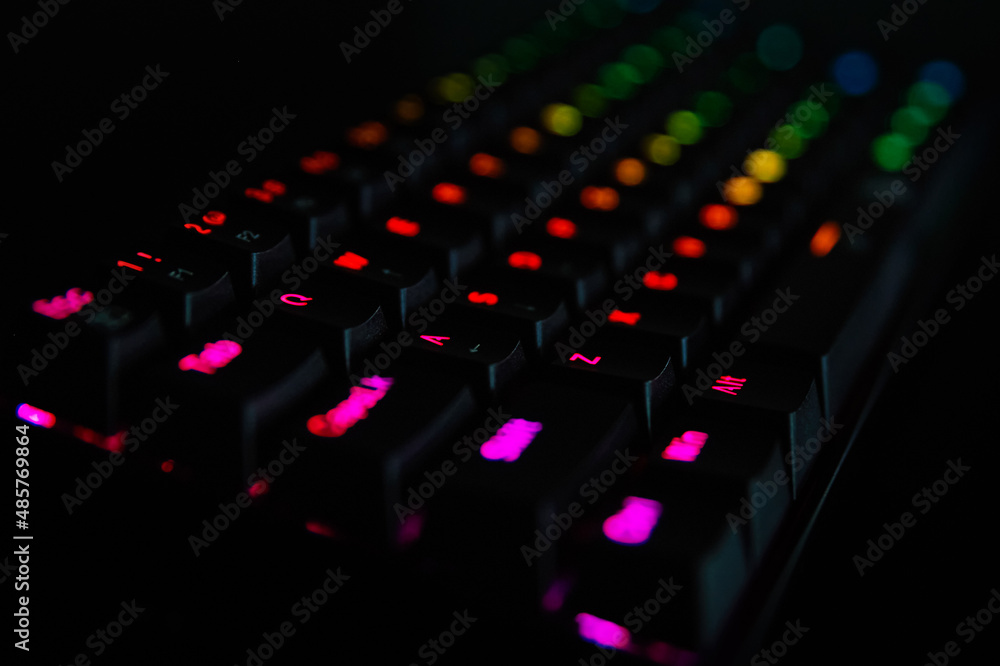 Poster gaming keyboard, close up. mechanical rgb keyboard for computer games on dark backgound