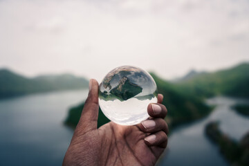 hand holding a globe