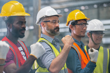 group of engineer professional successful team corporate workers standing in factory. teamwork...