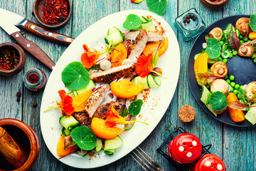 Sliced roasted steak with vegetables.