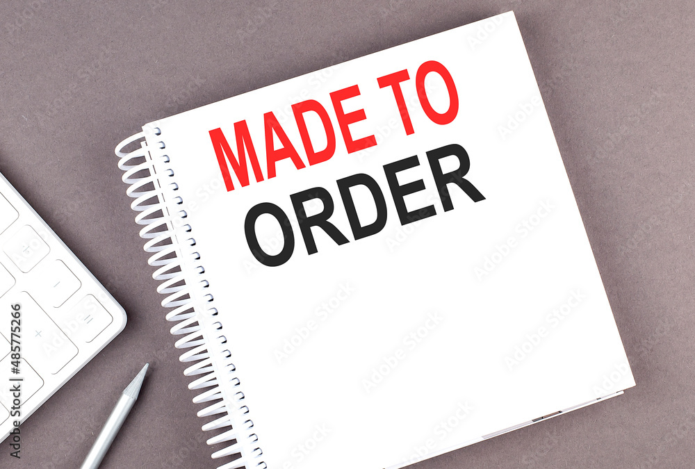 Poster made to order text on the notebook with calculator and pen