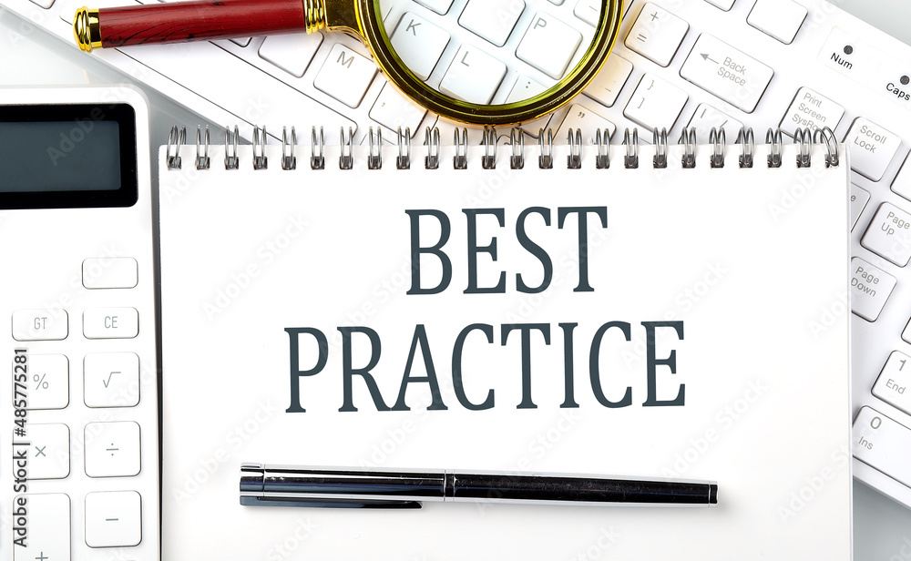 Poster best practice . text on notepad with calculator and keyboard,business concept