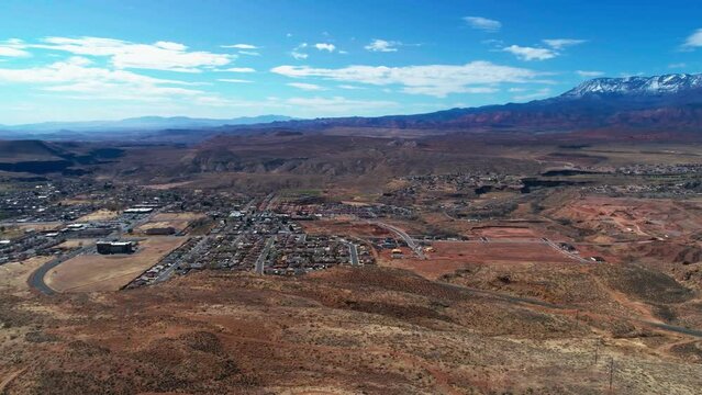 Aerial drone shot over a cliff of the city of Hurricane, Utah.