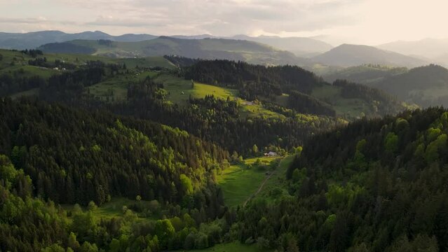 aerial view to a mountain village and farms in carpathians where people live in the mountains on farms