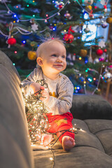 little child with christmas tree