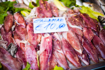 Calamari for sale at Ortigia Market, a popular place with locals for buying seafood, Syracuse...