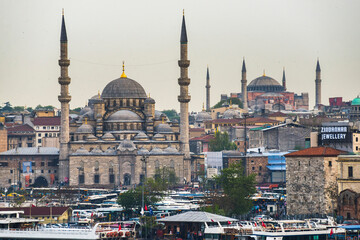 Obraz premium New Mosque (Yeni Cami) with Hagia Sophia (Aya Sofya) behind, Istanbul, Turkey, Eastern Europe