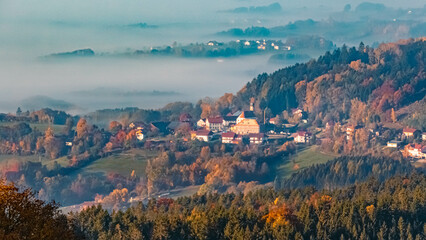 Obraz premium Beautiful autumn or indian summer foggy far view of Perasdorf, Bavarian forest, Bavaria, Germany