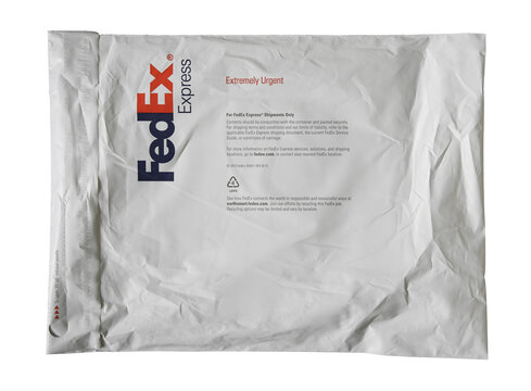 FedEx Express parcel bag. Lifestyle isolated photo of the Federal Express parcel