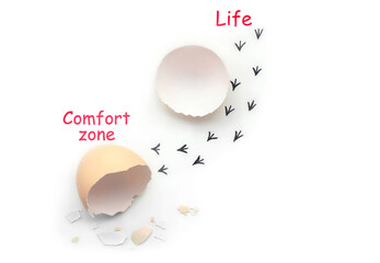 Footprints from an egg shell. First steps of a chick on a white isolated background. Concept of way out of the comfort zone, a new life, progress