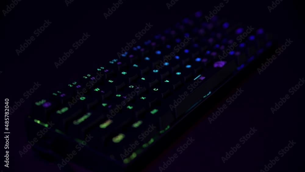 Poster gaming keyboard, close up. mechanical rgb keyboard for computer games on dark backgound