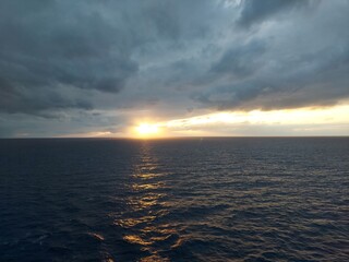 golden sunset and cloudy sky ,view from a cruise ship