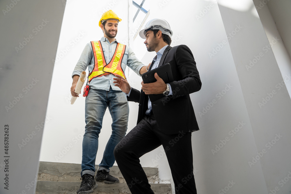 Poster businessman and engineer discussing architect project at construction site,development and construct