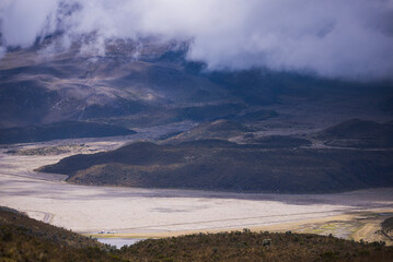 Cars at Lake Limpiopungo with the slopes of Cotopaxi in the background, Cotopaxi National Park, Ecuador, South America