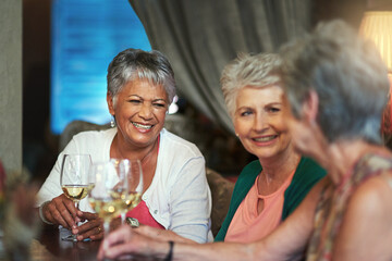 Its always a good time when they get together. Cropped shot of a group of senior female friends enjoying a lunch date.