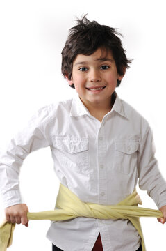 Cute kid tiying his torso with shirt