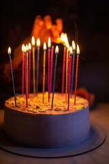 light candles on a birthday cake in honor of a birthday party