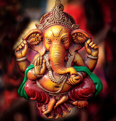 Fototapeta premium Ganesha statue on display with blurred background