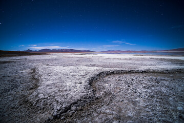 Stars over Chalviri Salt Flats at night (aka Salar de Chalviri), Altiplano of Bolivia, South America