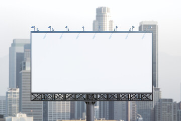 Blank white billboard on cityscape background at daytime, front view. Mock up, advertising concept