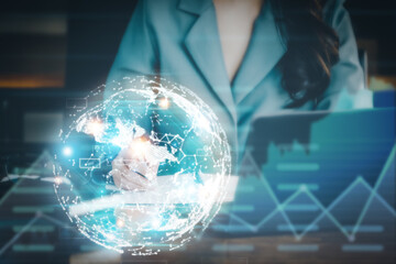 Investment concepts, businesswomen use document and computers to analyze stock markets, quantitative data collection, financial statement analysis, profitability through internet technology.