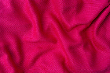 crumpled pink fabric texture background closeup
