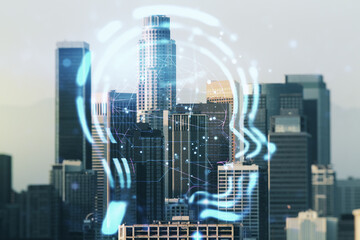 Abstract virtual artificial Intelligence interface with human head hologram on Los Angeles skyline background. Multiexposure