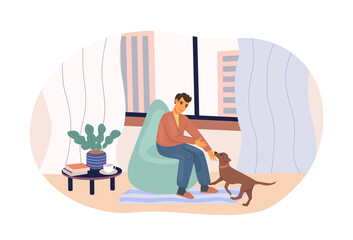 Fototapeta na wymiar Man playing with lovely dog sitting on armchair at cozy home. Love friendship between puppy and men