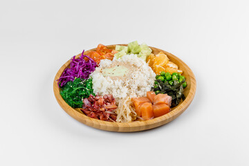Poke with rice, sesame seeds, cucumbers, fish tomatoes, tangerines, peas, cabbage and sauce. Wooden plate on a white background.