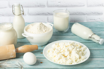 Fresh ingredients for a delicious homemade cake on a blue wooden table