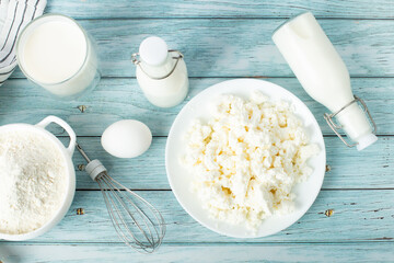 Fresh ingredients for a delicious homemade cake on a blue wooden table