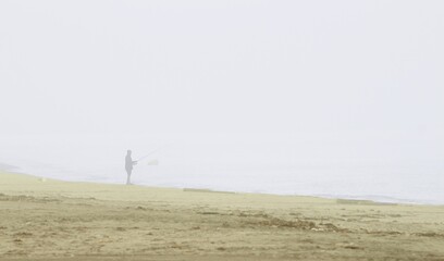 Photograph of fisherman in the morning mist. the beach of the Natural Park of Cabo de Gata, Almer&iacute;a, Andalusia, spain, tourism, tourist, advertising, travel, traveler, holidays, party, meet, tourist 