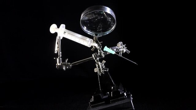 Syringe needle drug. Influenza vaccination concept drugs syringe needle disease immunization, disease prevention hospital concern handling subcutaneous injection doses of AIDS vaccine in vitro medical