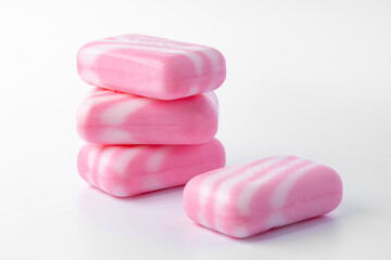Pieces of pink soap isolated on white background
