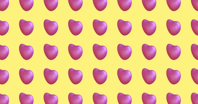 Seamless loop animation pattern with small pink hearts on a yellow background. Romantic Love Concept for Valentine's Day. 4k footage