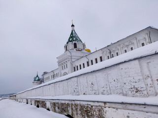 white stone walls of the monastery and domes of churches