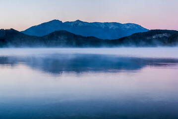 Misty sunrise at Nahuel Huapi Lake (Lago Nahuel Huapi), Villa la Angostura, Neuquen, Patagonia, Argentina, South America