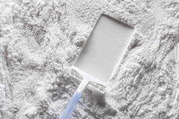 Artistic background, texture of sand and cement with a shaving machine. Color white