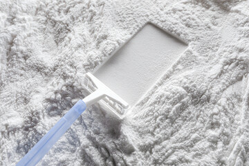 Artistic background, texture of sand and cement with a shaving machine. Color white