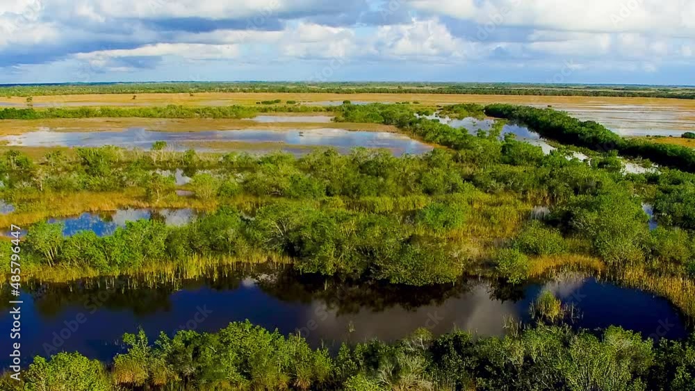 Wall mural Everglades National Park, Florida. Aerial view of swamp and sky at sunset from drone