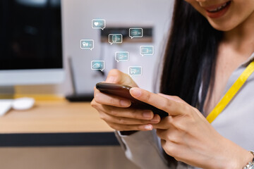 Businesswoman using smartphone with notification social media icons, internet digital marketing concept.