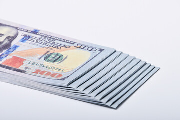 Money in the form of stairs dollars, isolated on a white background , finance business concept