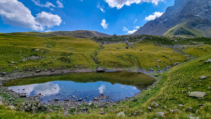 Colorful Abudelauri mountain lakes and hills in the Greater Caucasus Mountain Range in Georgia,Kazbegi Region. Trekking and outdoor travel in mountainous areas.Alpine pastures.Backpacking and trekking