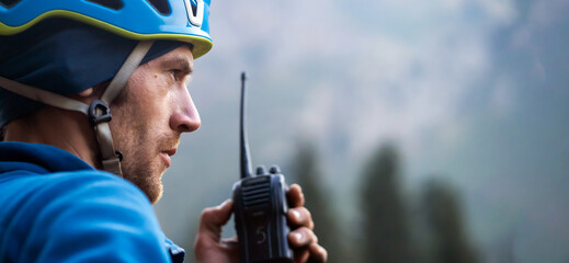 A mountain rescuer, man with a walkie-talkie.