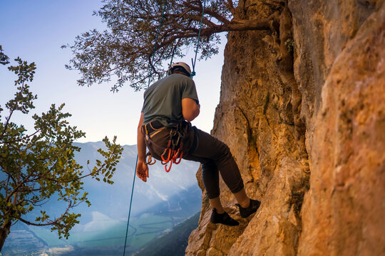 Man is climbing, hiking in the mountains.