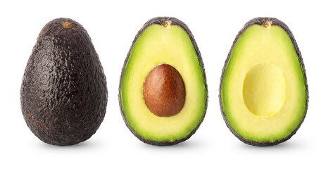 Isolated avocados. Whole black avocado fruit, half with seed and a half without isolated on white background with clipping path - obrazy, fototapety, plakaty